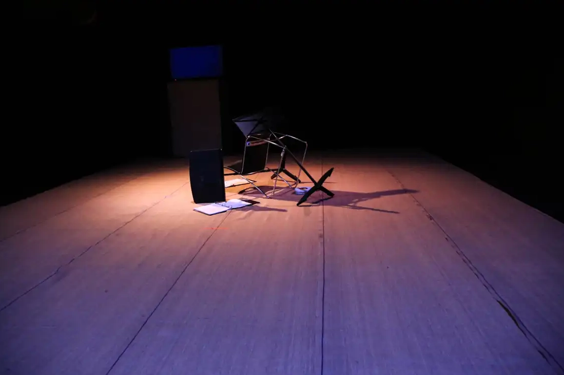 Chair flipped over theater wood floor
