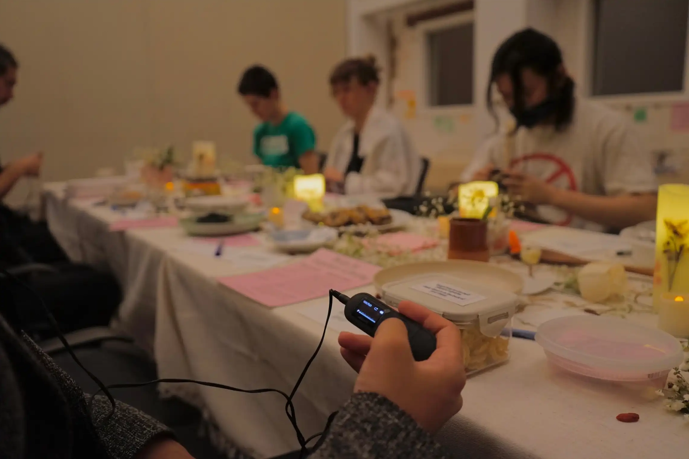 Closeup of MP3 device playing an audio recording for one of the exhibition's attendees